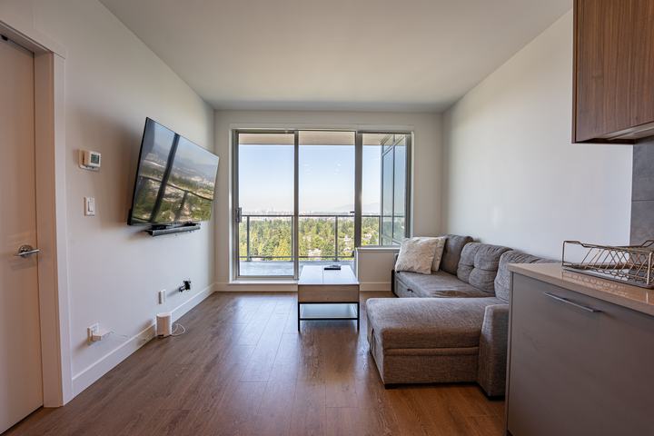 Condo living room opening onto the balcony