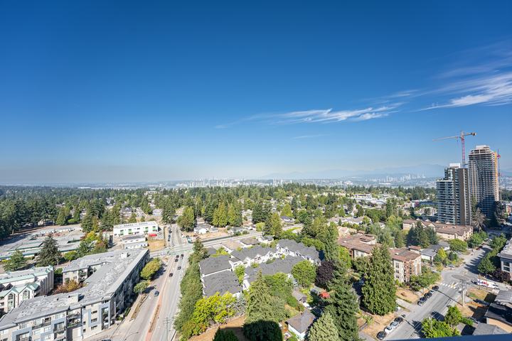 High-rise view over tree-lined neighbourhoods and towers