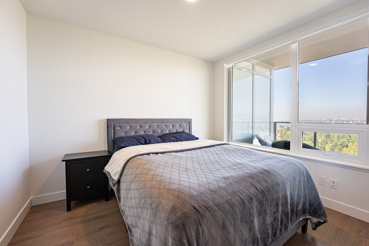 Condo bedroom with corner windows