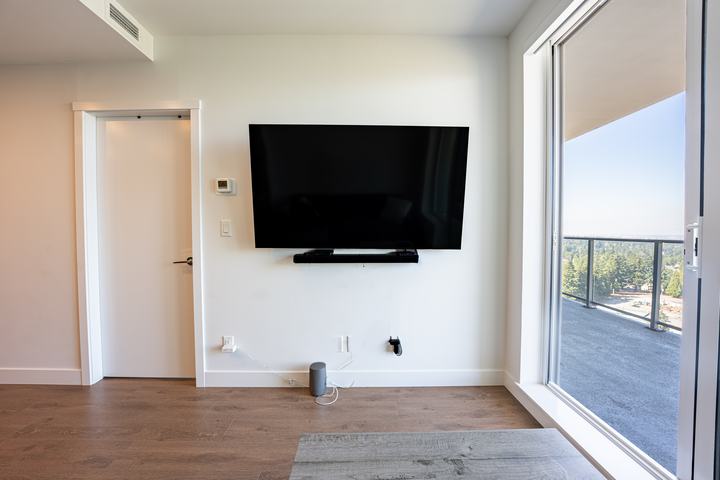 Bright condo living area opening to the balcony