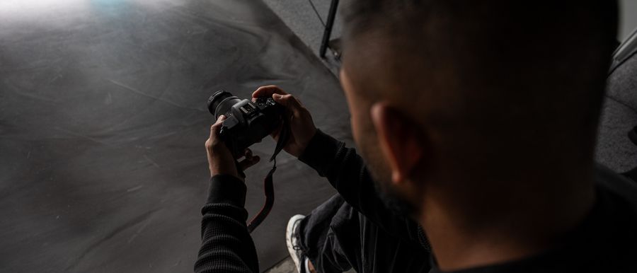 Pravin, founder of Newhive Studios, checking a shot on his camera during a production