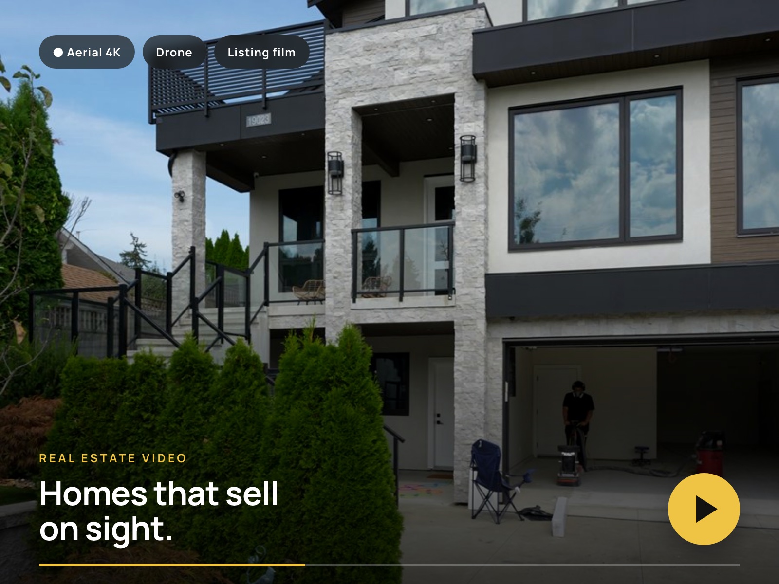 Aerial-style listing film frame of a modern home
